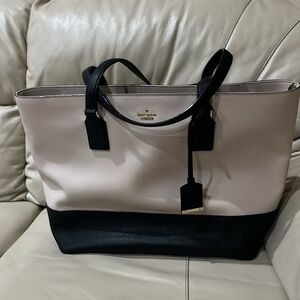 Kate Spade bag tan tote bag with black detailing, striped lining, gold metal
